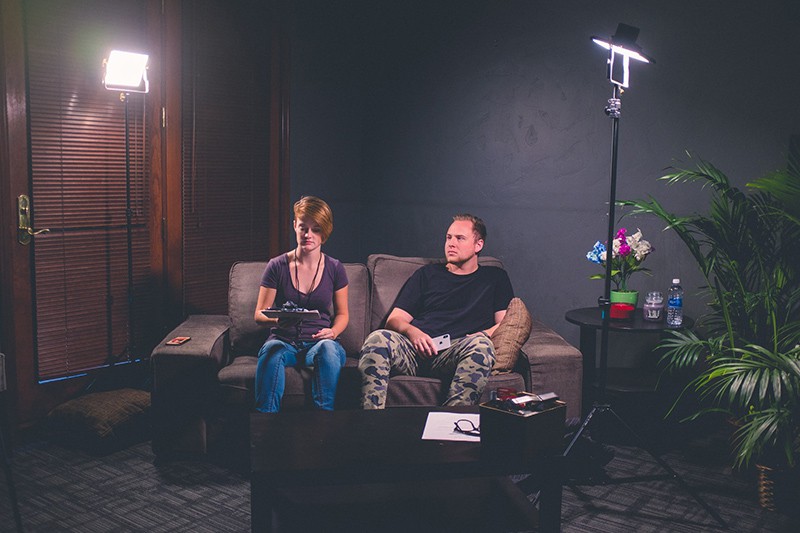 man and woman sitting on couch in the living room