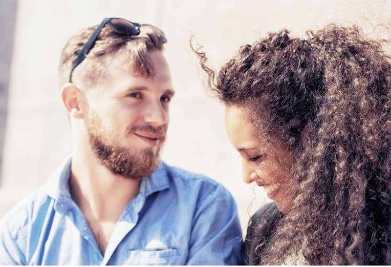 shy man and woman talking to each other