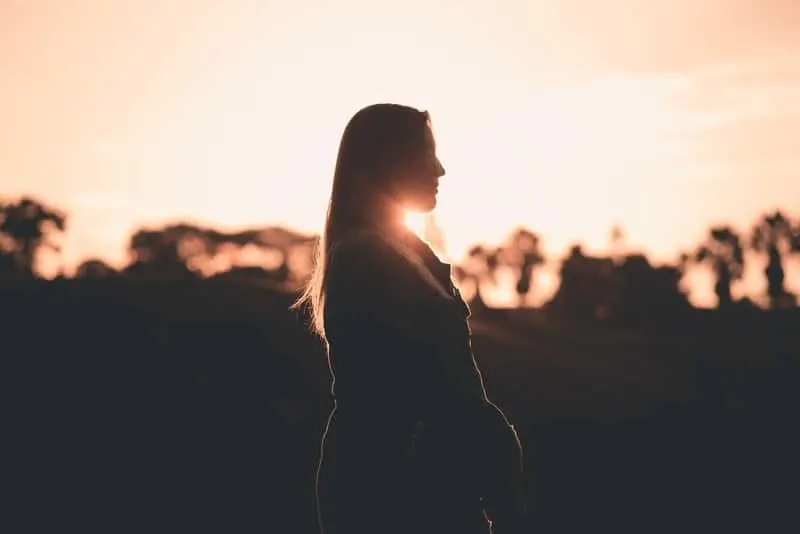 silhouette of woman in a sideview during golden hour