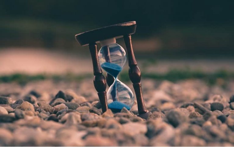 Hourglass with blue sand
