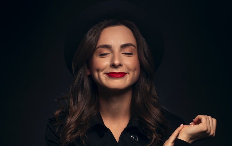 Happy woman in black leather jacket