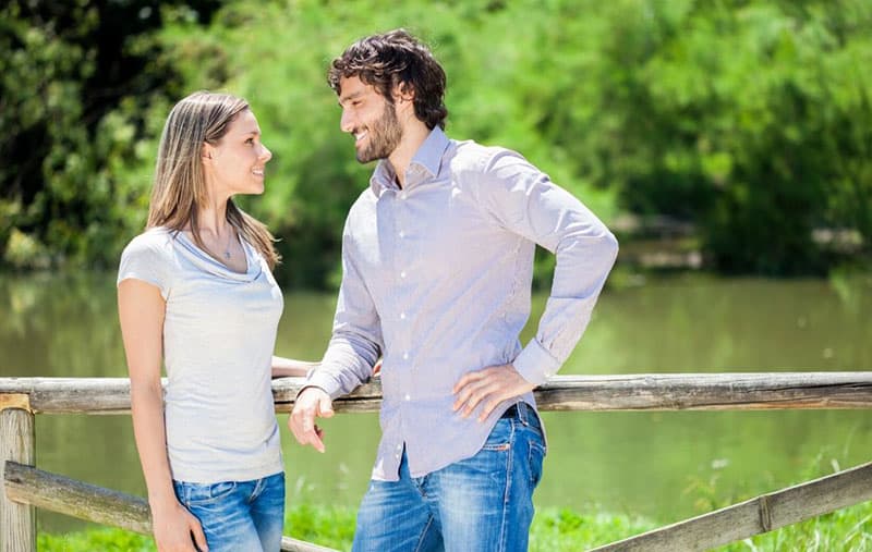 woman standing beside a man 