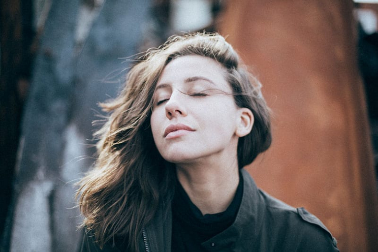 young woman breathing deeply
