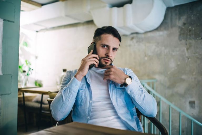 serious man talking on the phone
