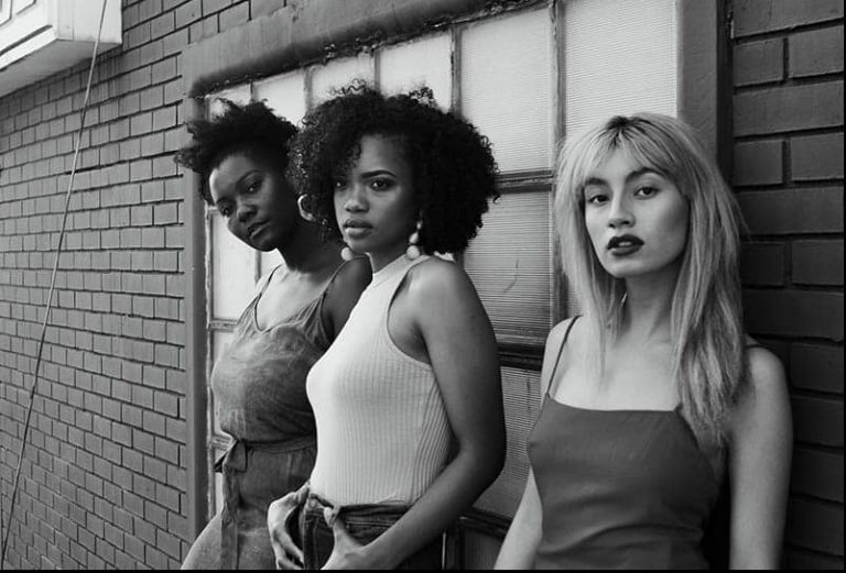three woman looking at the camera