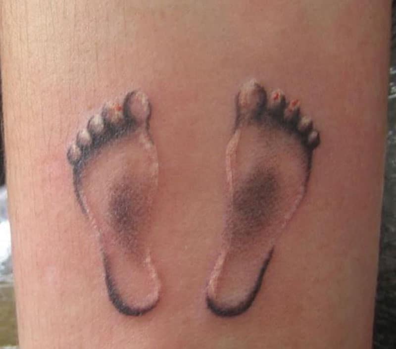 baby footprint tattoo inked somewhere in the body