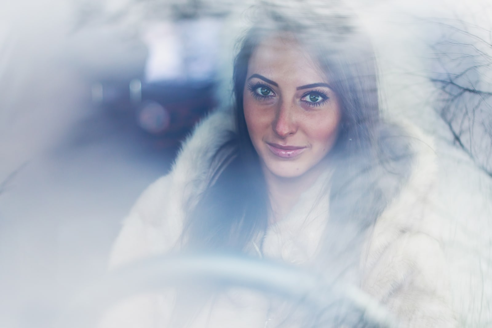 a portrait of a beautiful brunette driving a car