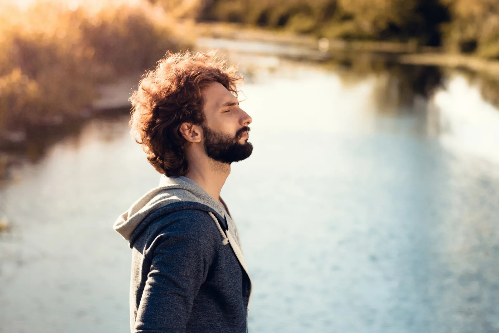 bearded man on river background