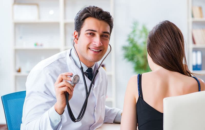 doctor checking patient inside the clinic