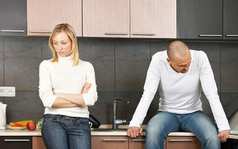 man and woman having disagreement inside the kitchen not talking to each other