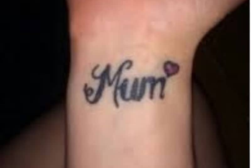 mum tattoo inked in the wrist part of the hand