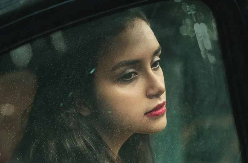 woman inside the car looking sad outside