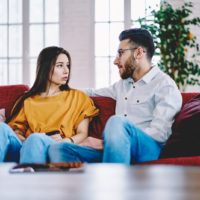 serious couple in love spending leisure time together talking