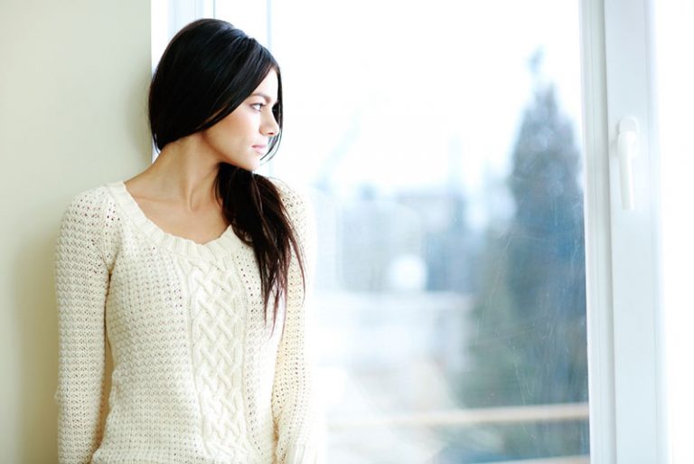 sad young woman looking at distance