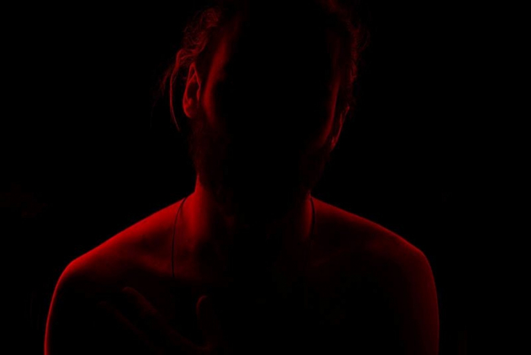 young guy in darkness