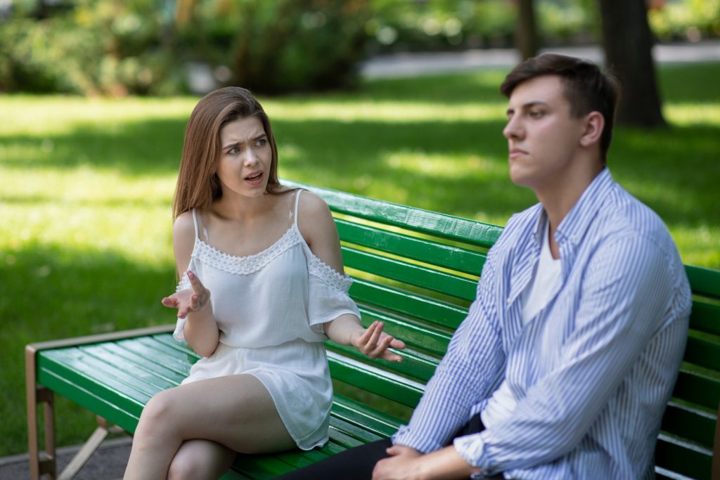 a couple arguing in the park