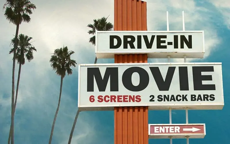 drive in movie and snack bar sign