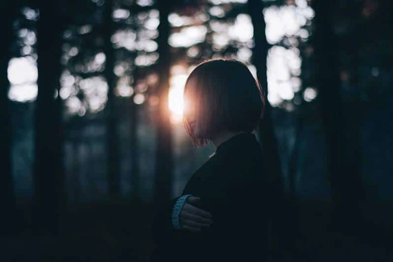 sad woman in forest