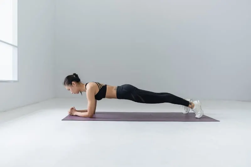 woman in black top doing yoga indoor
