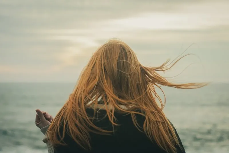 woman looking at sea during daytime