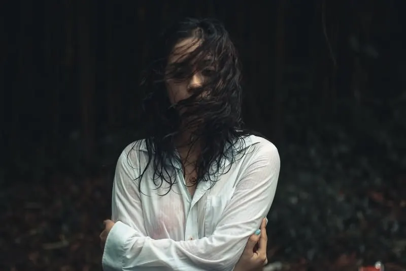woman with wet hair and wet white top 