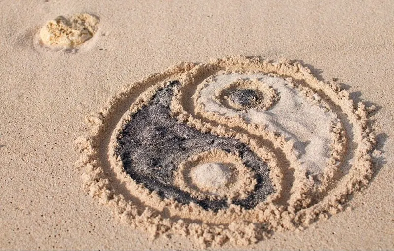 yin yang symbol drawn on the sand