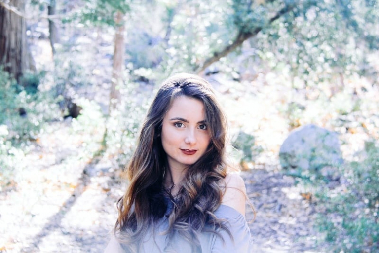woman standing in forest during daytime