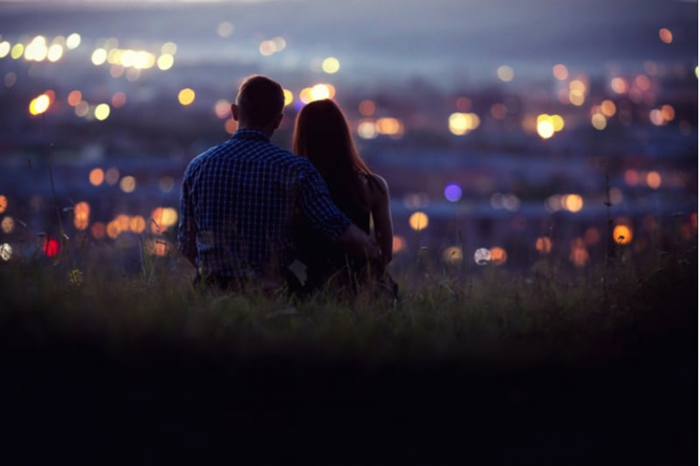 lovers man and woman against background in the night