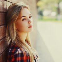 young blonde woman looking away