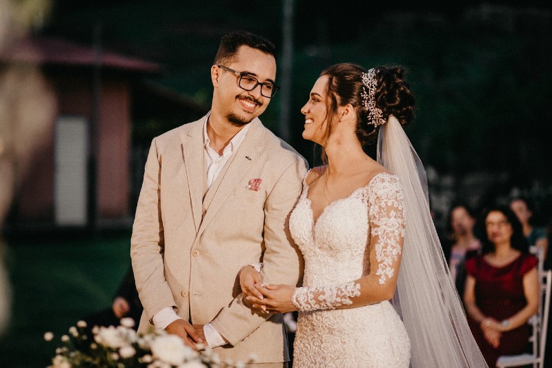 bride and groom making eye contact while standing outdoor