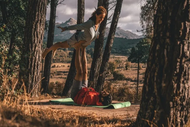man and woman doing yoga outdoor