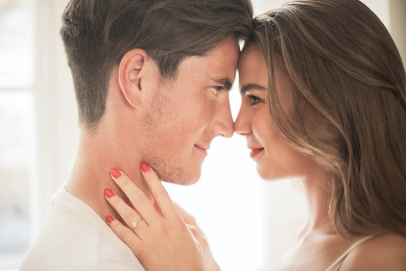 man and woman making eye contact indoor