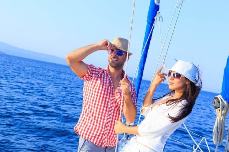 couple romantic getaway on a yatch in the middle of the sea