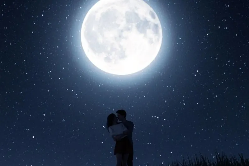 love couple under the moonlight and starry skies hugging