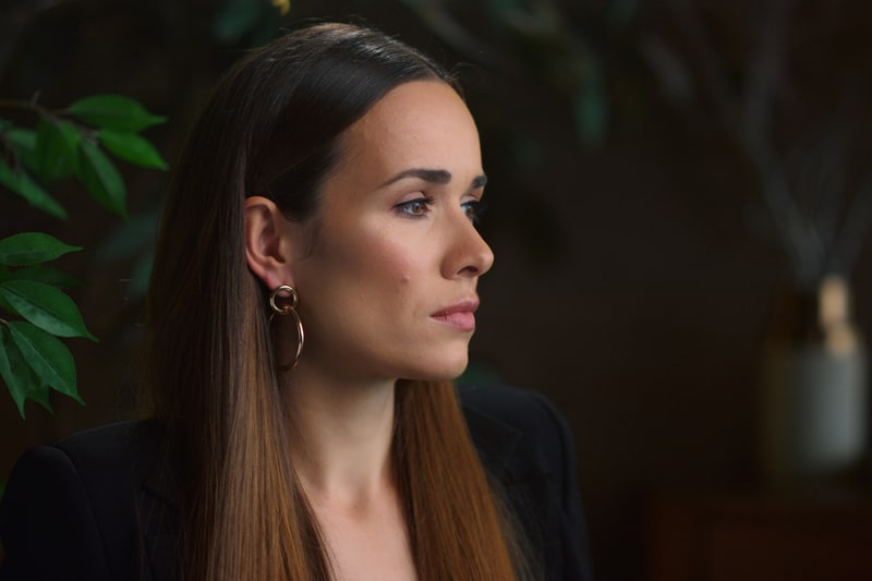 pensive businesswoman in the homebased office looking afar