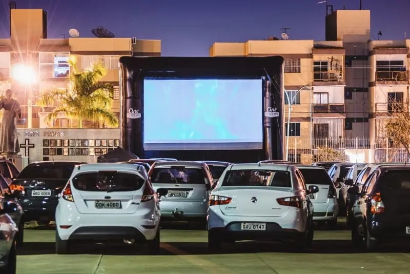 people watching movie inside cars