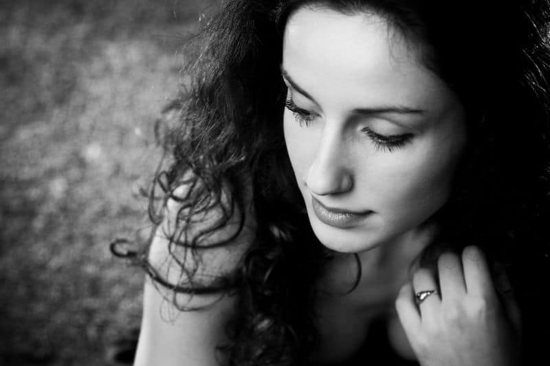 portrait of young pensive woman in grayscale theme image