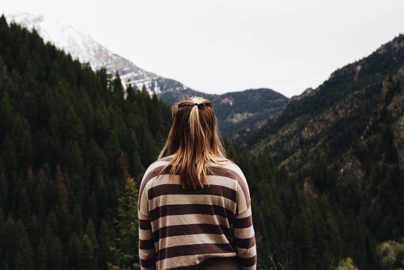 woman in striped top looking at mountain