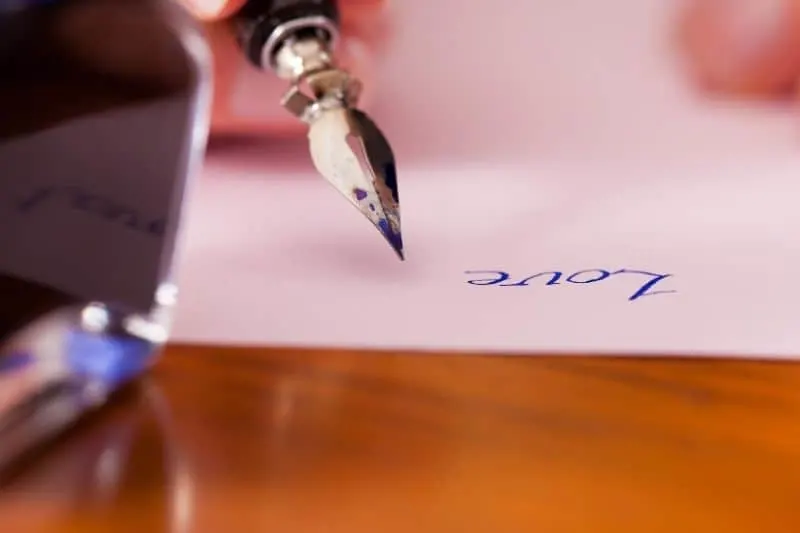 writing love letter with a sign pen in focus 