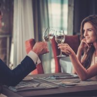 beautiful of the couple having dinner date and clinking wine glass