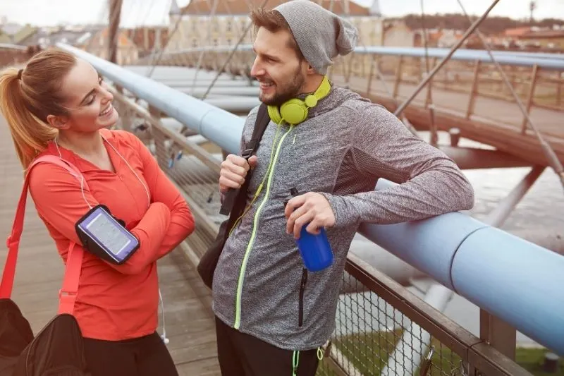 after workout conversation between couple on athletic wear outdoors 