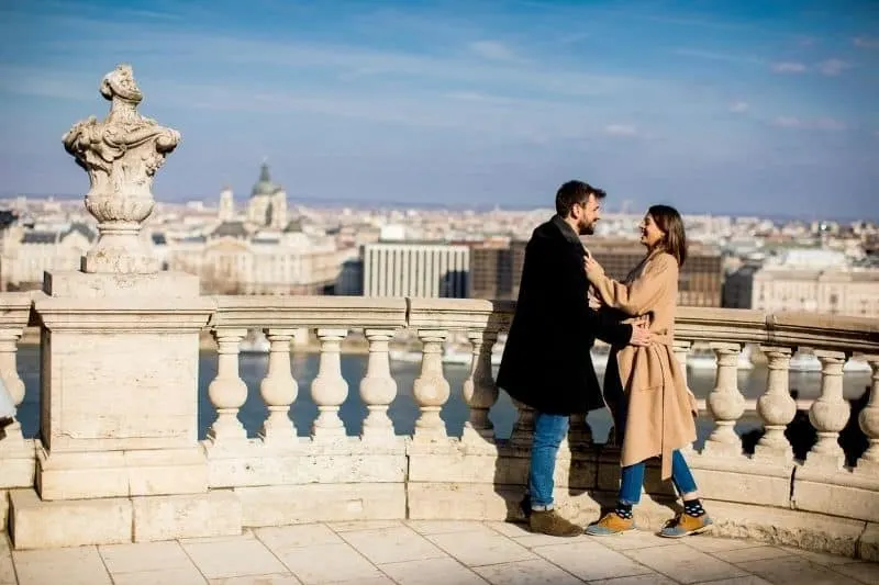 beautiful couple in love hugging at the background of magnificent view of Budapest