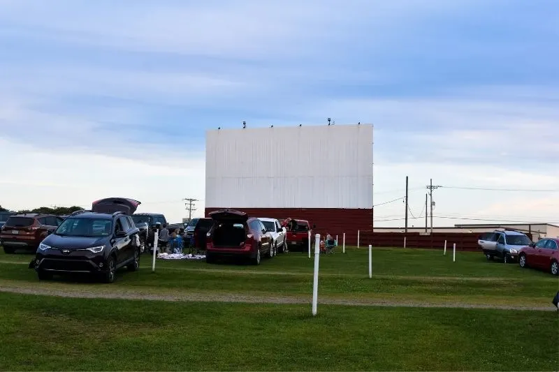 drive in cinema outdoors with cars filling up the field