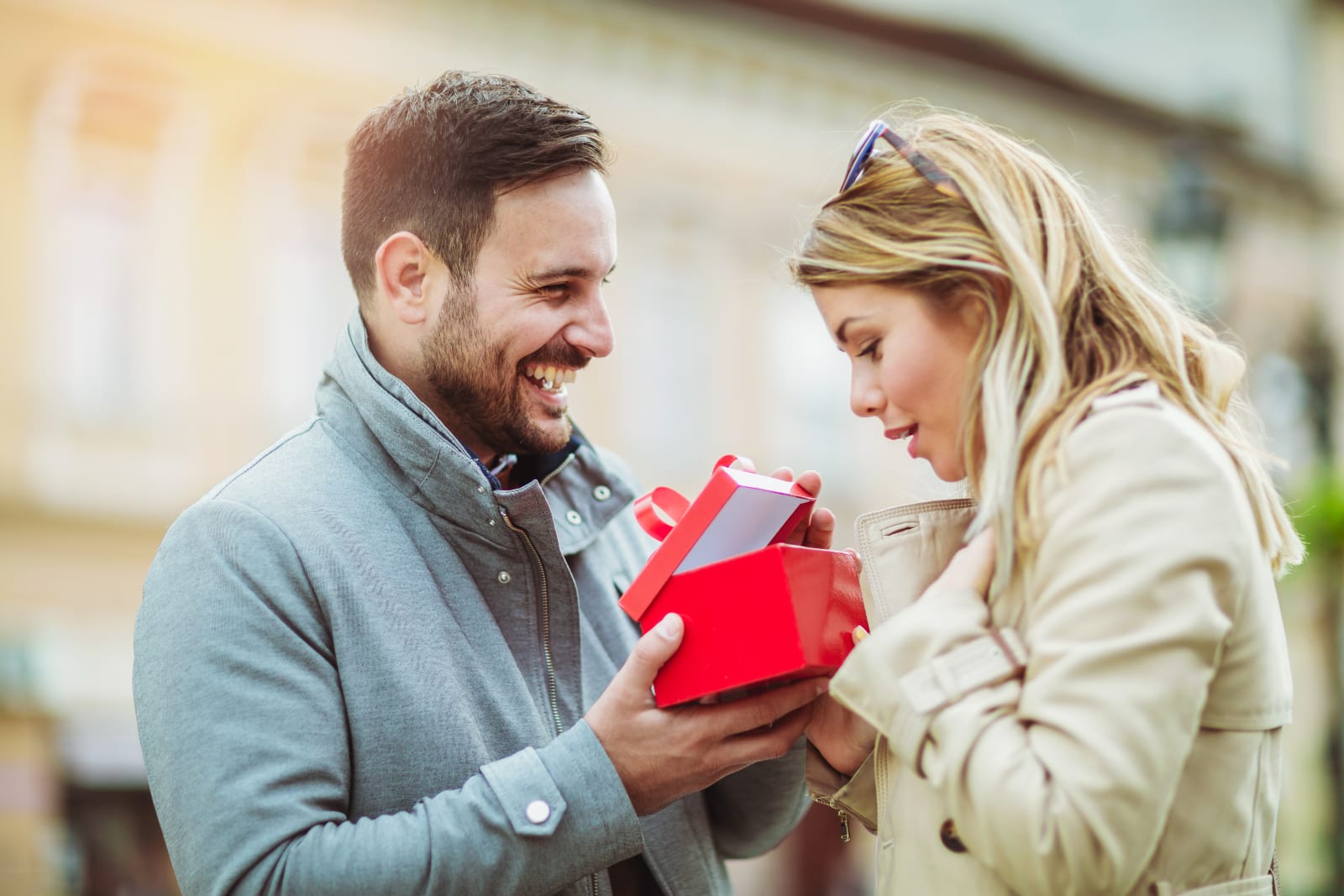 man giving gift to woman