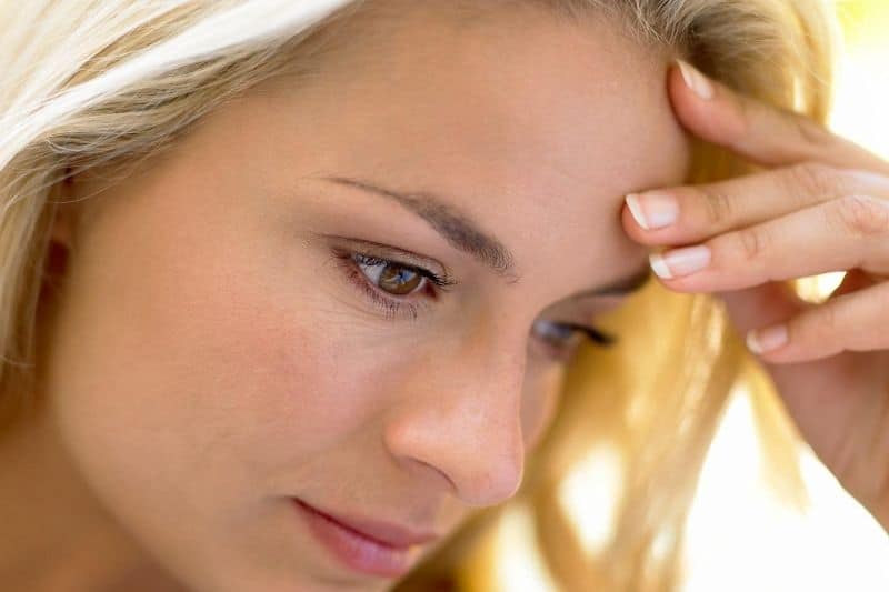 pensive caucasian woman cropped face in focus