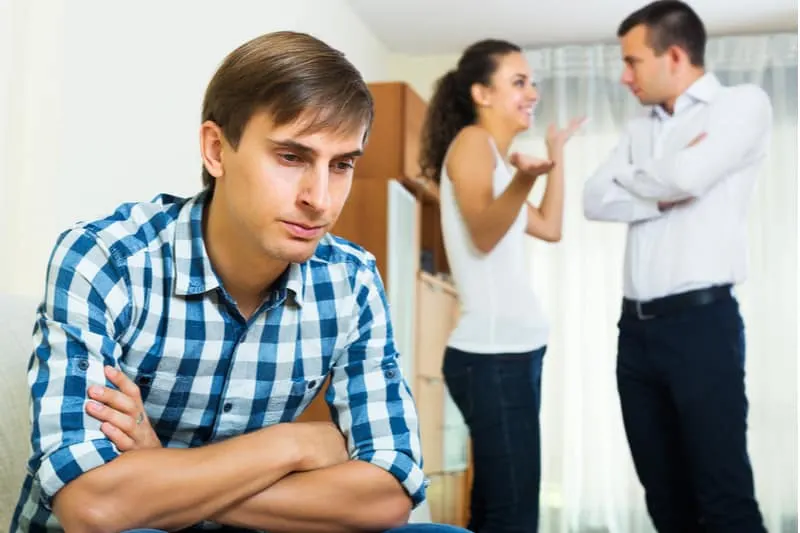 unhappy exboyfriend and woman flirting with another man