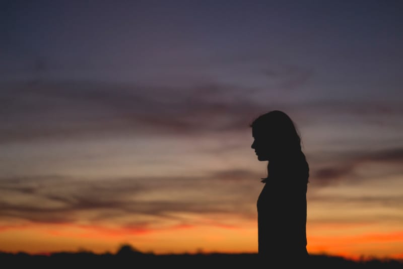 woman standing outdoor during sunset