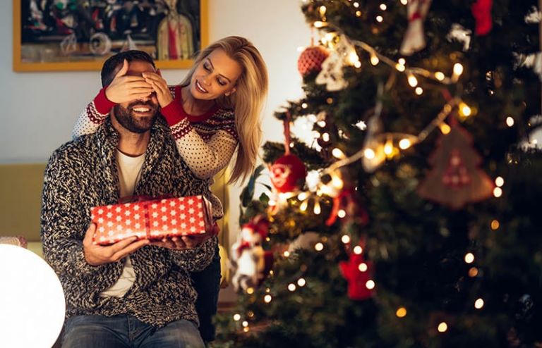 Beautiful girl surprising her boyfriend with a present.