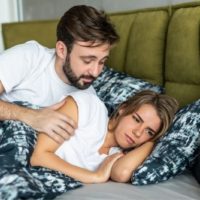 offended woman doesn't speak to his husband while lying in bed