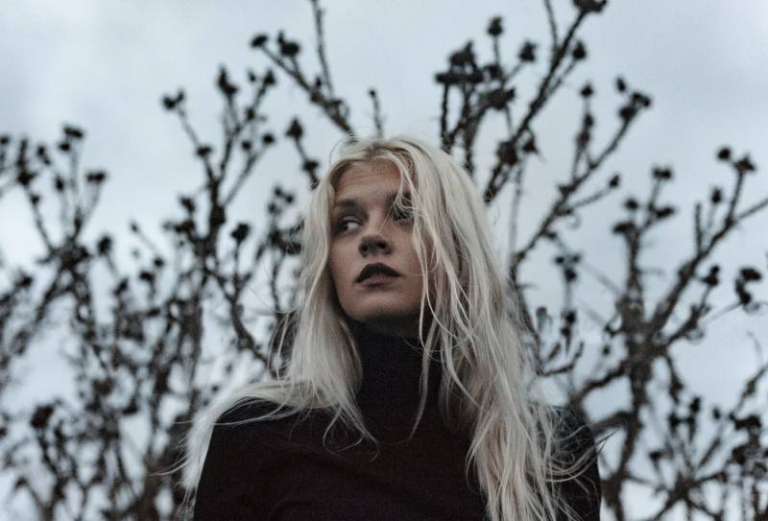 Woman wearing black turtleneck